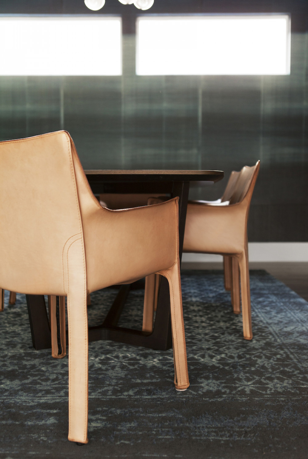 dining-chair-detail-light-brown-leather-area-rug