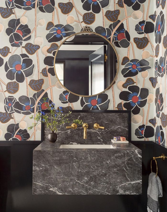 Modern designed restroom with a bold wallcovering.