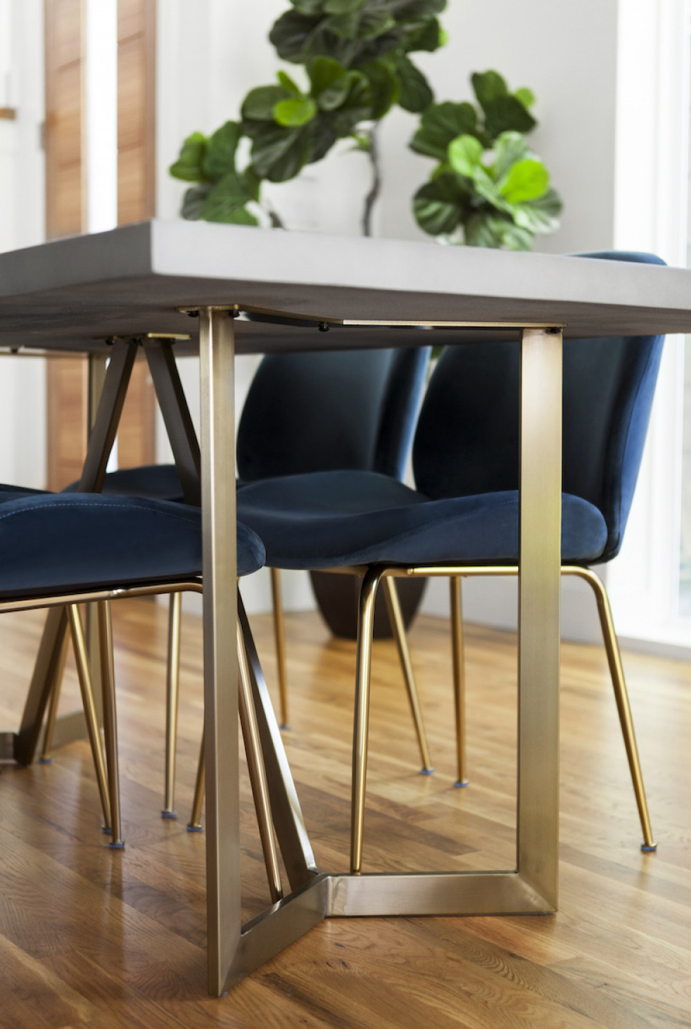 dining-table-gold-legs-blue-suede-dining-chairs