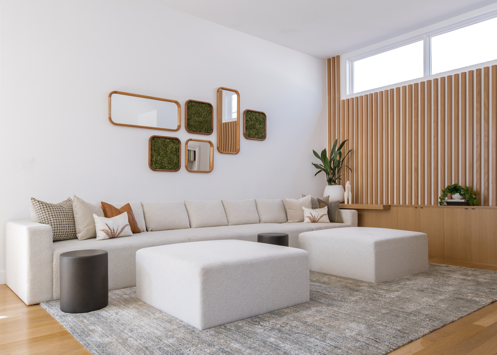 living-room-interior-design-large-sofa-geometric-mirrors