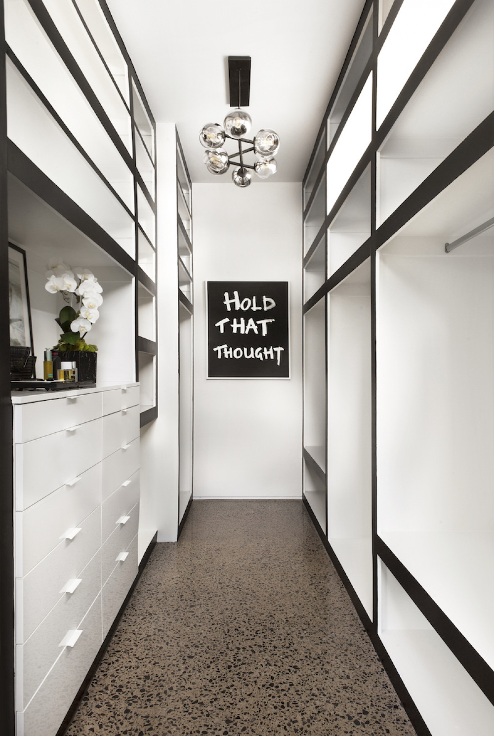 primary-bedroom-walk-in-closet-black-and-white
